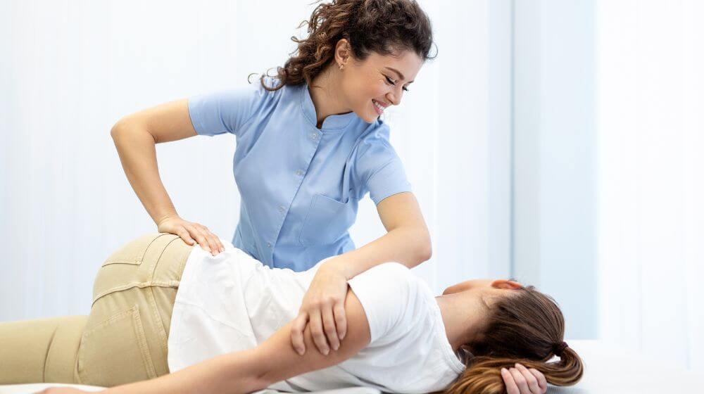 Chiropractor treating a patient in clinic