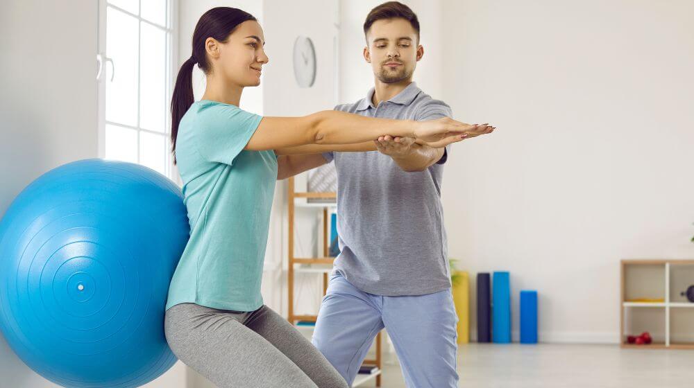 Image of a physiotherapist with a client